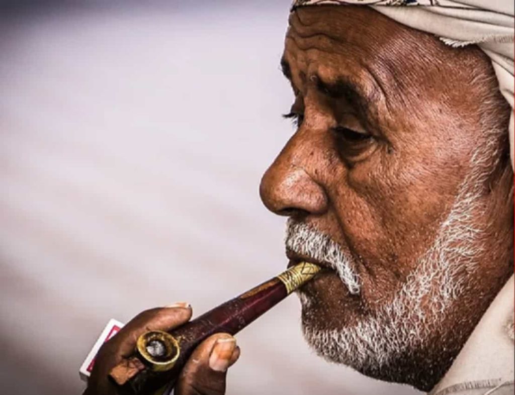 Artisan crafting a pipe with Eastern Mediterranean tobacco